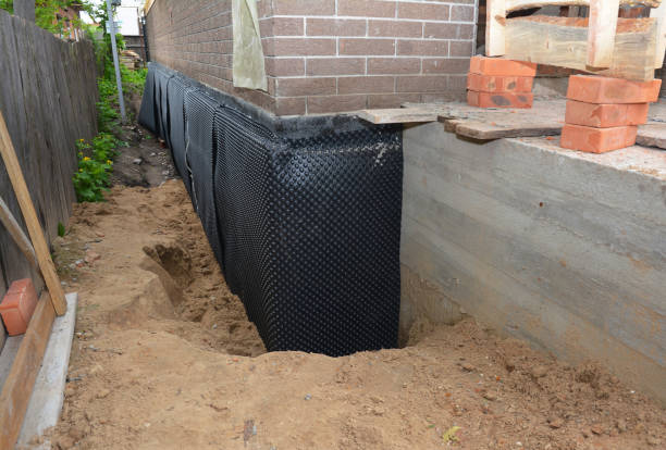Happy homeowners after waterproofing job in Farmingdale